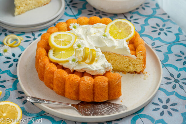 lemon cake with syrup and whipped cream