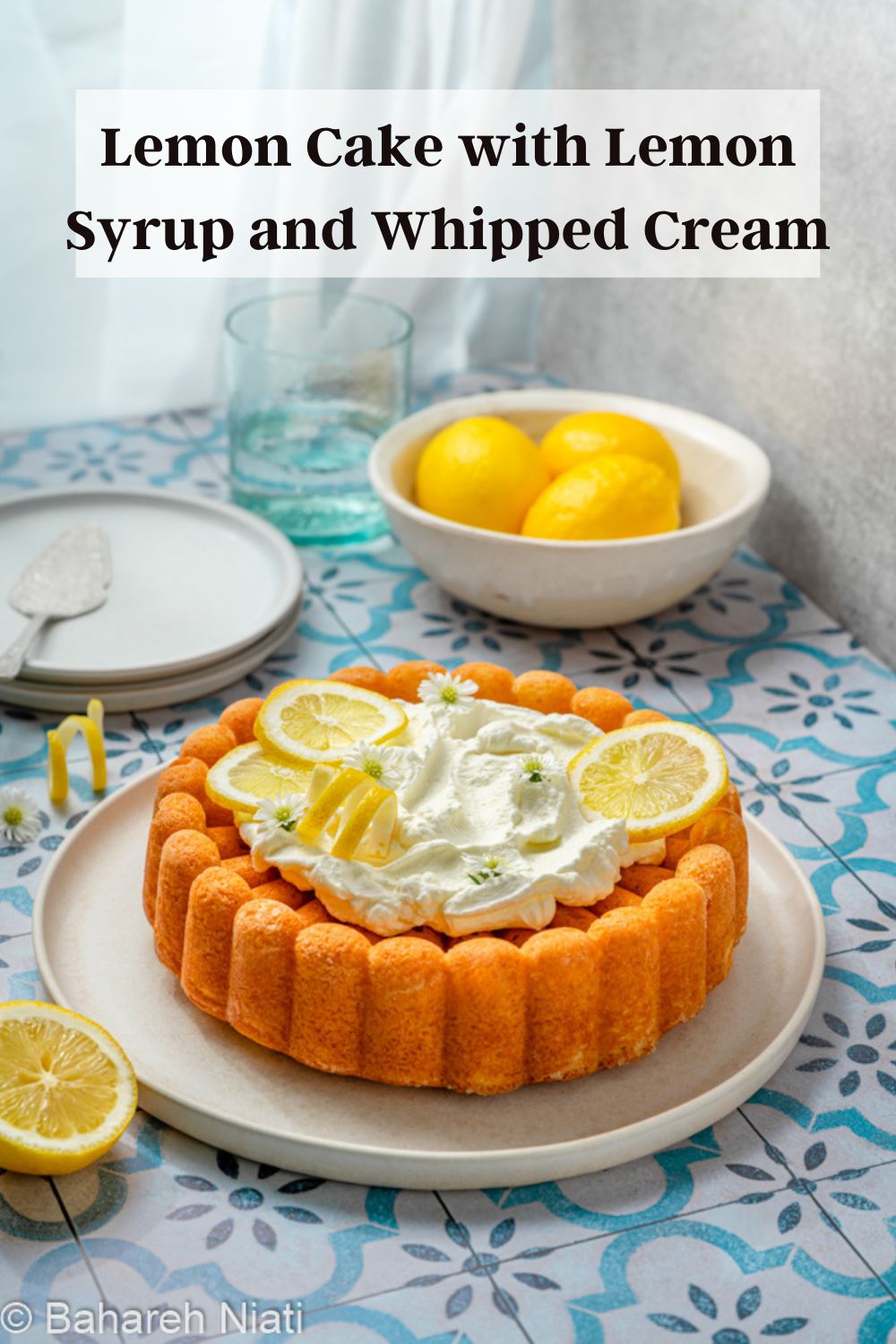 lemon cake with syrup and whipped cream